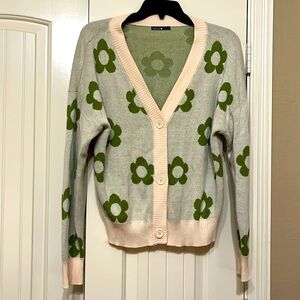 Very light pink cardigan with green flowers